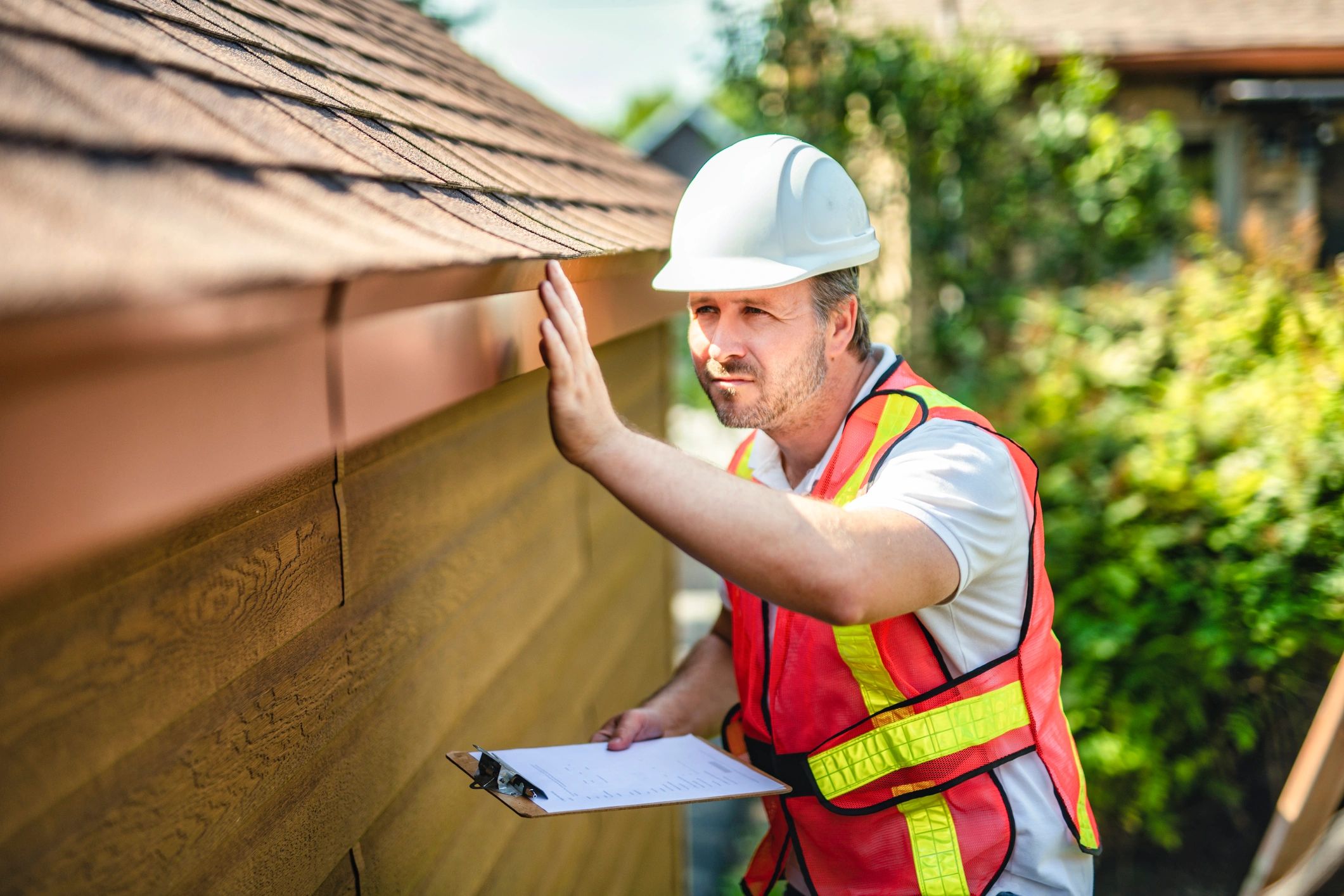 Roof inspector with clipboard